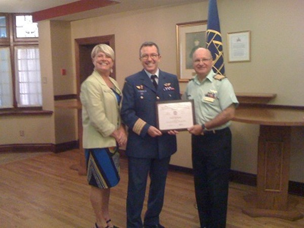 Laurie Mack, chapter vice president for programs, joins Col. Boucher (c) and Col. Girard at the September luncheon.